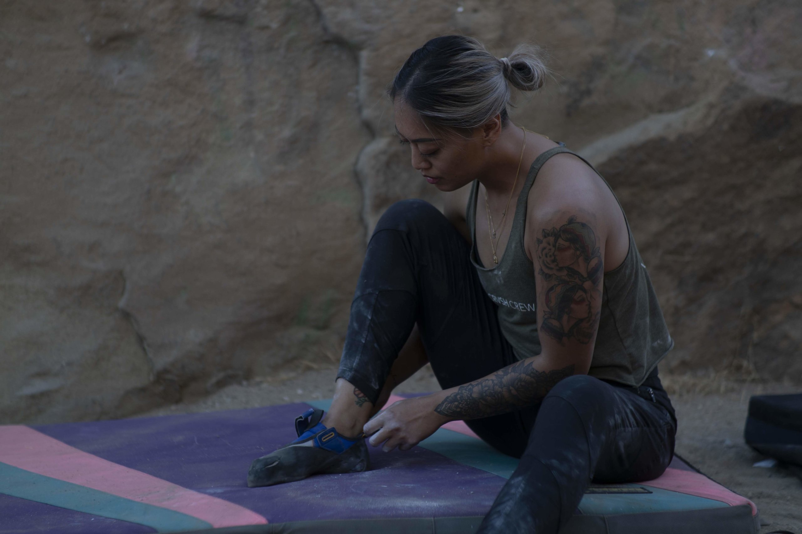 Sabrina Padua hanging out next to boulder