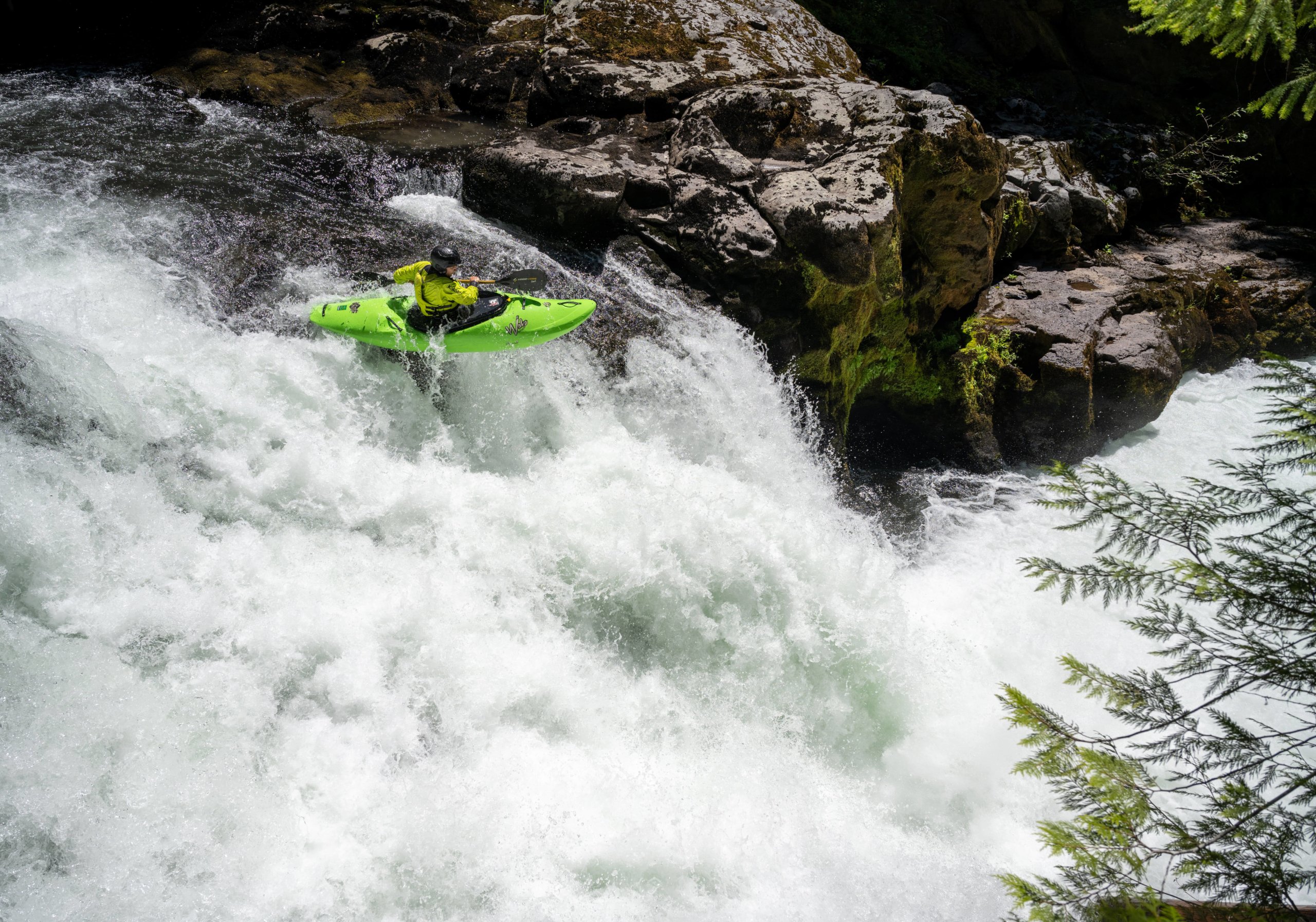 Natalie Anderson kayaking off a waterfall