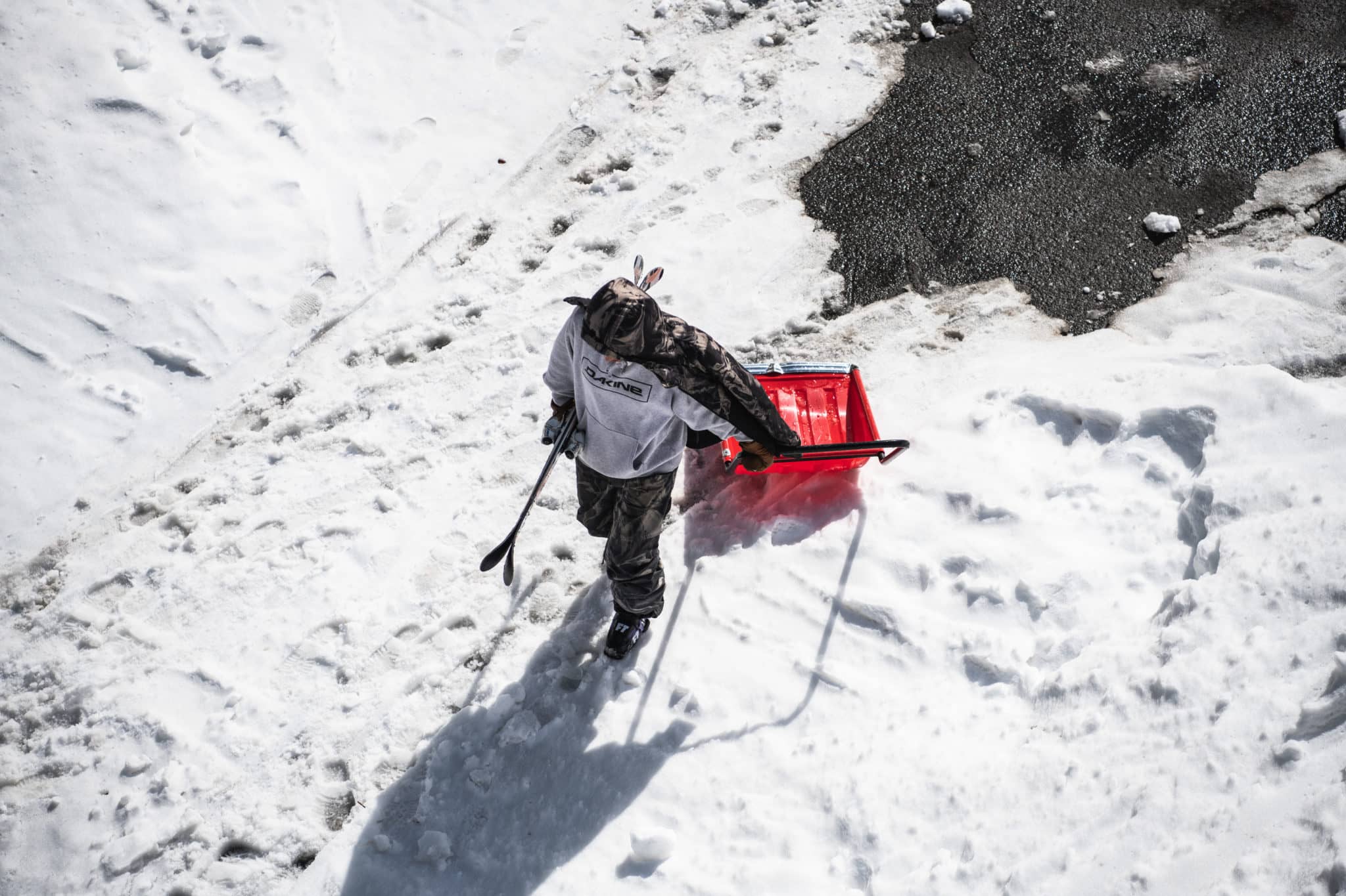 Photo taken by Laura Obermeyer of skier shoveling during Jyosei
