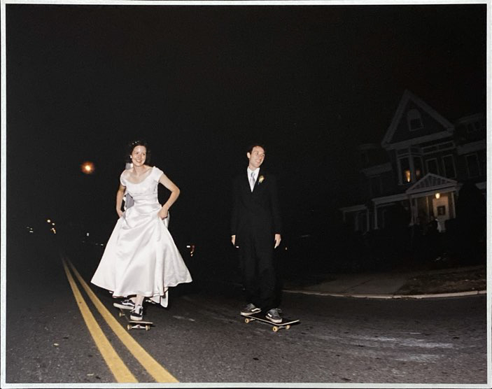 PomPom Skateboards co-founder Sarah Cameron and husband Roger skateboarding during their wedding.