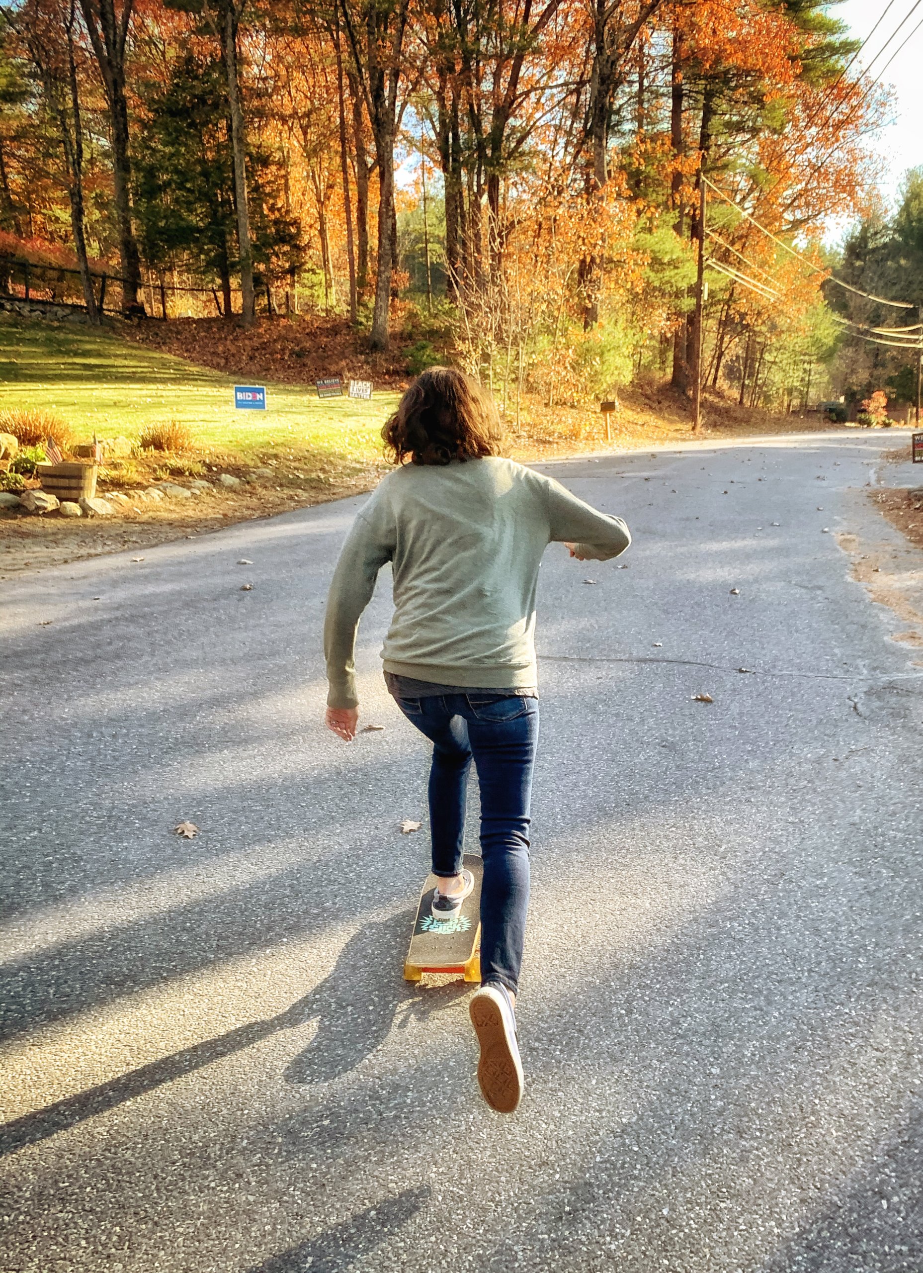 PomPom Skateboards co-founder Sarah Cameron pushing on skateboard.
