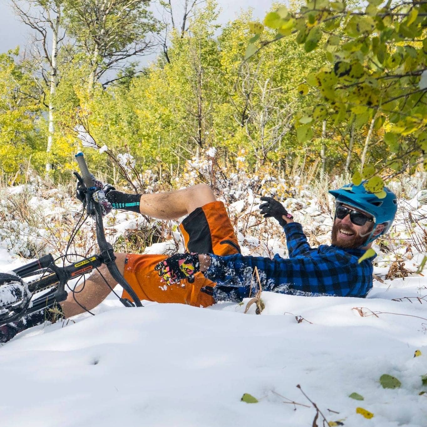 Cy Whitling laughing on his mountain bike