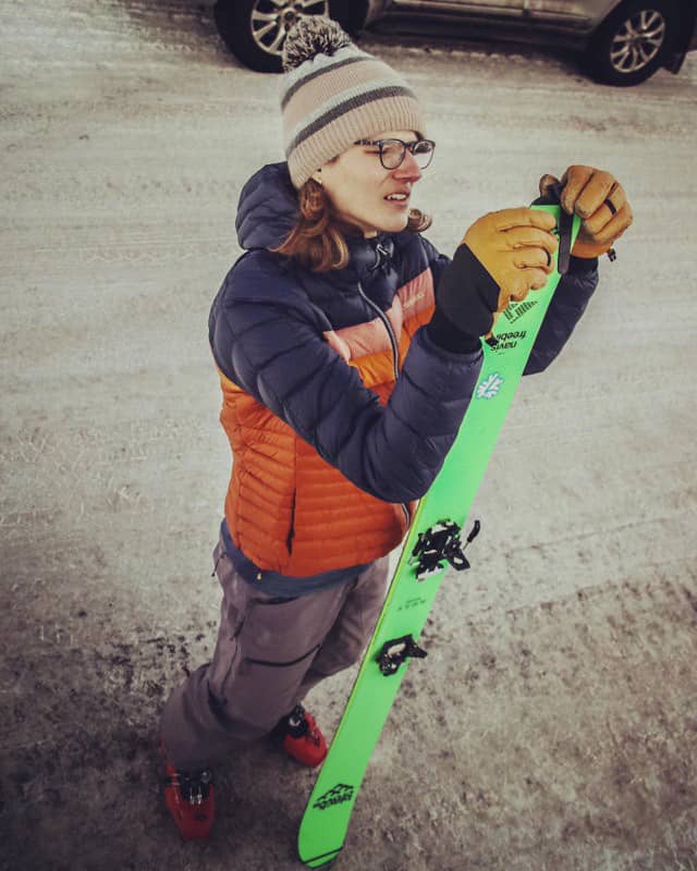 Valerie Arcara futzing with her ski skins