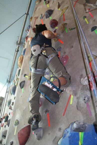 Clara Soh climbing with her external fixator on her ankle.