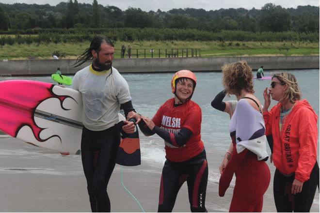 Melissa and Zoe greeting Hannah as she comes out of the water from her heat.