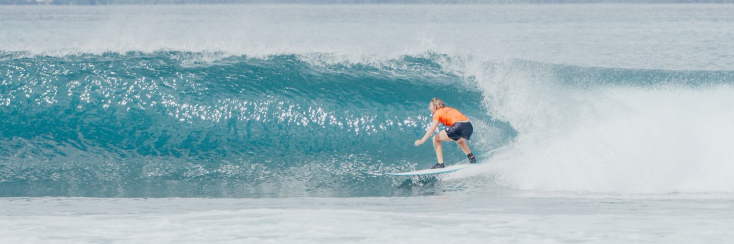 Melissa Reid surfing in a barrel