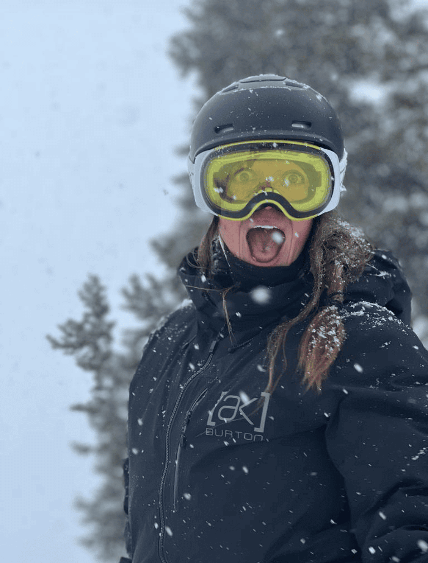 Elizabeth Niotis making a silly face in her snowboarding gear.