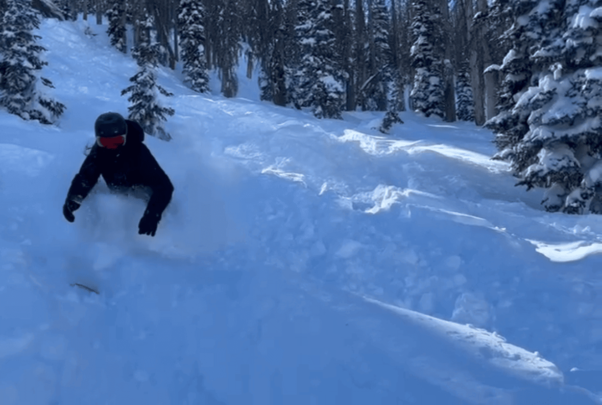 Elizabeth Niotis snowboarding in that deep pow